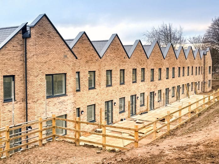 ICW: Supporting housebuilders and developers to deliver quality new homes Bridgend, Wales, UK - 14 December 2025: New houses in a social housing development as part of the construction of a Wellbeing Village near Bridgend town centre, repreenting quality new homes