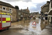 Planners must prioritise climate resilience Masham, North Yorkshire, England / United Kingdom - February 9 2020: Flooded Streets of Masham following the heavy rain from Storm Ciara As fire and floods become more common, we must factor climate resilience in local planning, argue the RTPI and the Town Planning Institute