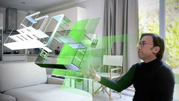 Virtual Ai Designer showing next-generation 3D hologram technology held in his hand. Augmented virtual reality is about to become a part of life in the near future. / You can see the animation movie of this image from my iStock video portfolio. Video number: 2101156127