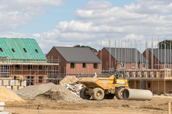 Construction industry building site. Houses at various stages of completion. The latest critical minerals investment will aid the supply chain