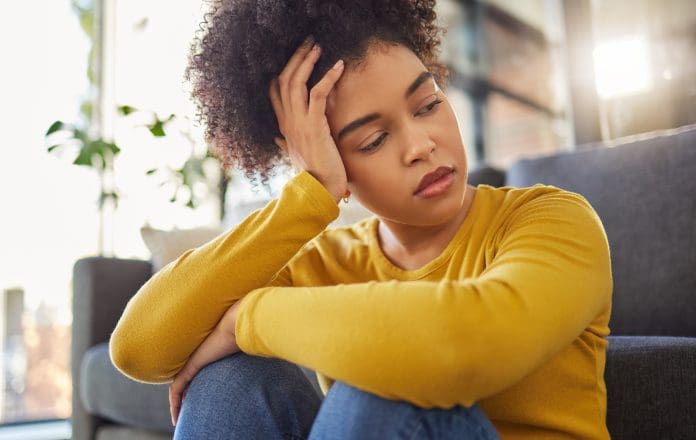 Young unhappy mixed race woman looking sad and thinking alone at home. One tired hispanic woman looking depressed and going through a breakup at home Young homeowners are at increased risk of hiring rogue builders, according to research by the FMB