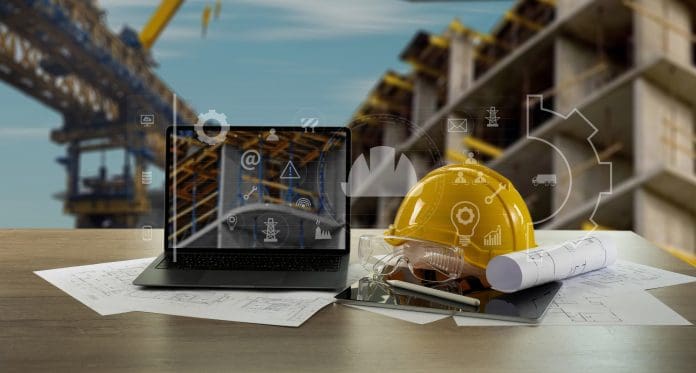 Engineer architect industry 4.0 using computer construction site, industrial and innovation infographic at building futuristic architect control innovation safety design Artificial Intelligence must not distract from the construction skills crisis, says MP