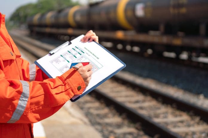 Engineer is checking on the chemical hazard material form with background of crude oil or chemical transportation. The NAO's HS2 reset report warns that the window for delivering value is closing