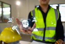 Beyond the hype: The real AI revolution in construction and engineering starts behind the scenes Smart construction technology concept with engineer activating virtual engineering tools.