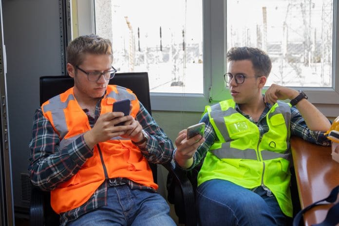 Engineers Taking a Break and Relaxing with Smartphones in Energy Facility Break Room The HS2 fraud action team has been expanded