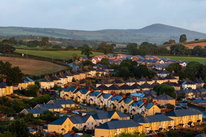 Houses in Denbigh at sunrise with countryside backdrop, Denbigh, Denbighshire, Wales, Britain Welsh housing supply must increase to unlock opportunities, says HBF
