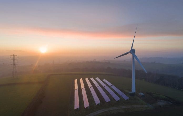 Aerial view of wind turbine and solar panels at sunset The Energy Independence Bill: From ambition to delivery