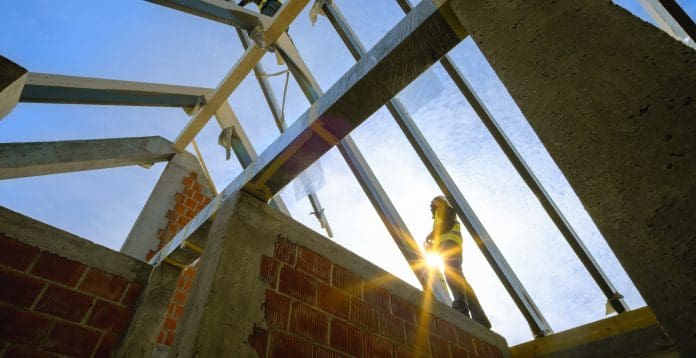 Construction worker working at construction site How climate differences affect new developments