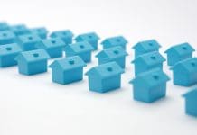 Britain doesn’t just need more homes, it needs better places Rows of toy blue houses. Miniature houses arranged in three rows. Model cottage settlement. Miniature homes. Many small houses. Real estate in cottage village. Model city neighborhood property market