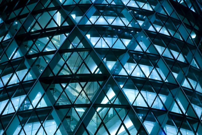 Modern Office Building Illuminated at Night Leading architecture companies launch sustainability standard for glass