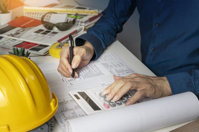 Engineers sit and work on building design and system work.,construction work safety,construction business and real estate Construction finance teams are losing a working day every week to payment admin