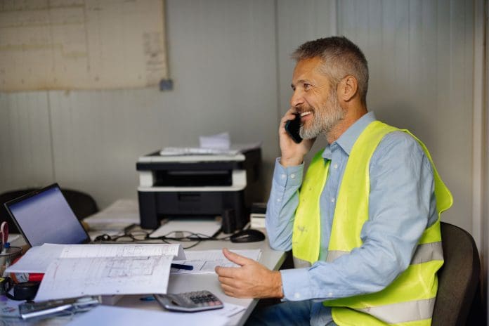 Construction Manager in Office Discussing Project Plans on Phone Call NFB Academy: Strengthening leadership, compliance and sustainability across construction
