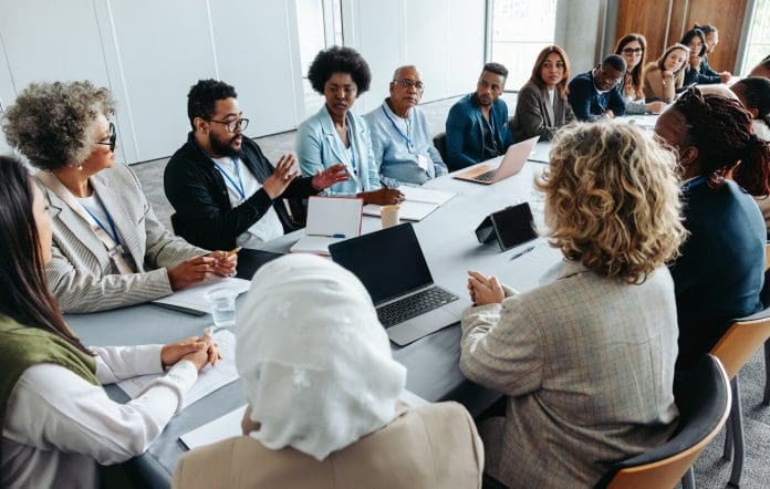Multiethnic group of businesspeople brainstorming and strategizing in a meeting New CIH committee members are being sought