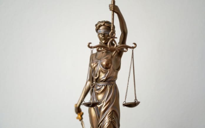 Justitia with scales and sword against a neutral background Reforms may remove construction legal blockers for major projects