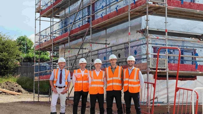 Timber frame assembly begins at affordable housing development in Rugby