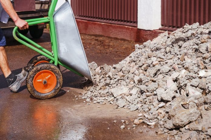 to unload wheelbarrow construction debris,a Earned settlement for construction migrant workers is changing
