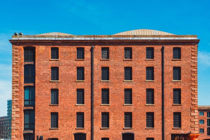 Albert dock building in liverpool showing red brick facade A roof over our head: Assessing the Protecting Built Heritage report