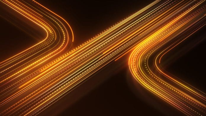 Glowing yellow lines on orange background. Neon information stripes flying. big data transfer. Curved neon lines. Orange neon color. yellow black background. HD, 4K, Heat networks are entering a new phase – and projects need to catch up