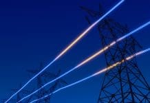 Back to the energy future High voltage electric transmission tower with glowing current line, electrical power transmit through wire to city and house at night, Renewable green energy grid infrastructure concept 3d rendering