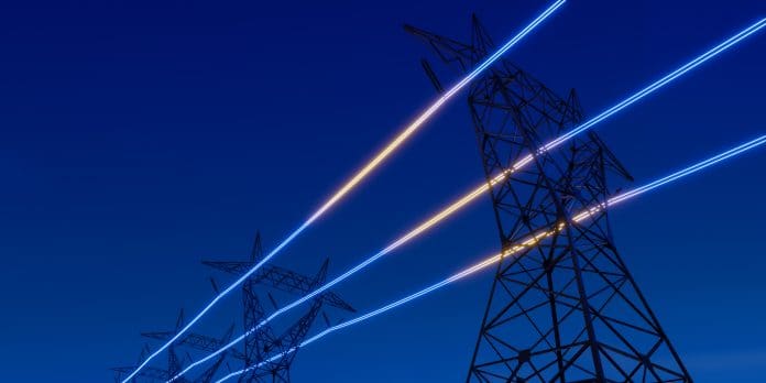 High voltage electric transmission tower with glowing current line, electrical power transmit through wire to city and house at night, Renewable green energy grid infrastructure concept 3d rendering High voltage electric transmission tower with glowing current line, electrical power transmit through wire to city and house at night, Renewable green energy grid infrastructure concept 3d rendering