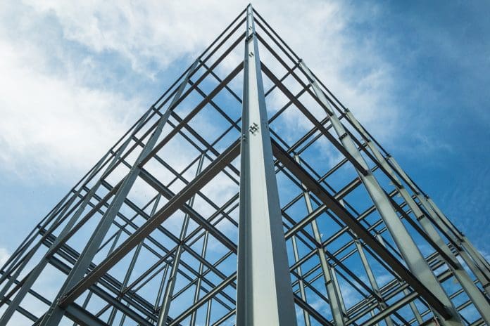 Structure of steel for building construction on sky background.