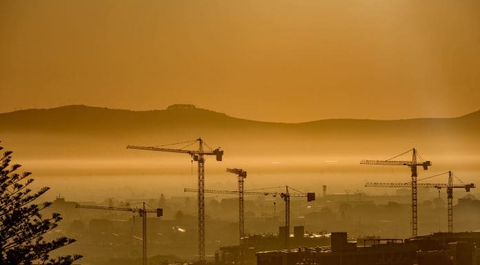 Construction Tower Cranes City Scape in the distance at sunrise Cape Town