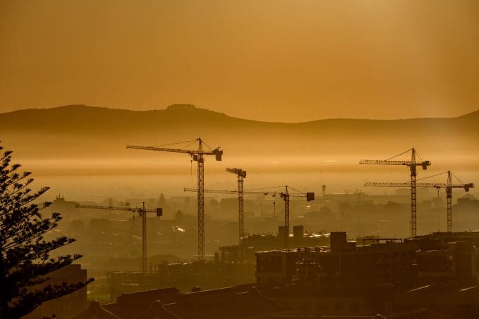 Construction Tower Cranes City Scape in the distance at sunrise Cape Town