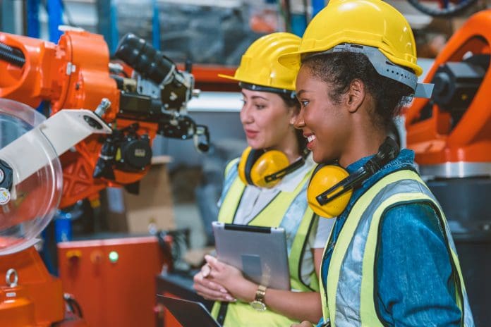 Women engineer worker working team helping together at work in modern advance machine factory. ICE Connects: Women in Fellowship has received an award in recognition of its work to get women in construction
