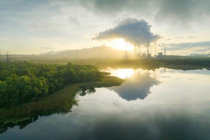 Aerial view coal power plant station in the morning mist. How is carbon thinking in the built environment evolving?