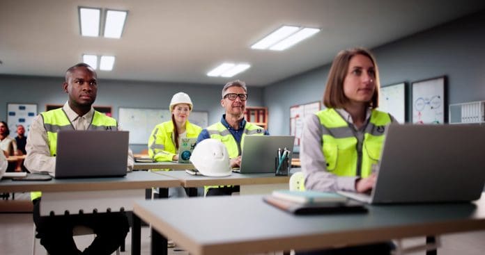 Students Work In A Classroom With Laptops Why you can't learn construction skills in a classroom alone