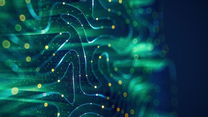 Technology Background with Flowing Lines and Light Particles Abstract digital background featuring flowing blue and green lines with glowing yellow particles, evoking a sense of data flow or neural networks.