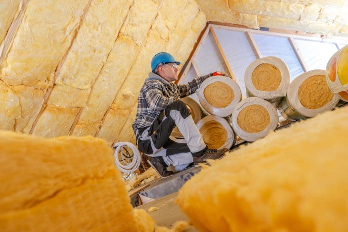 Worker Installing Mineral Wool Insulation in a Residential Attic During Daytime Renovation Process Actis is developing its popular U-value simulator to offer even more help to builders, specifiers and contractors wanting to select the most appropriate insulation products for their projects