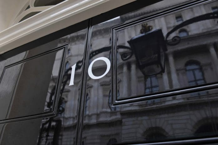 A new PM won’t fix Britain’s building problem. A longer memory might Close up detail (picking up reflections) of the front door of number 10 Downing Street, official office and HQ of the British Prime Minister
