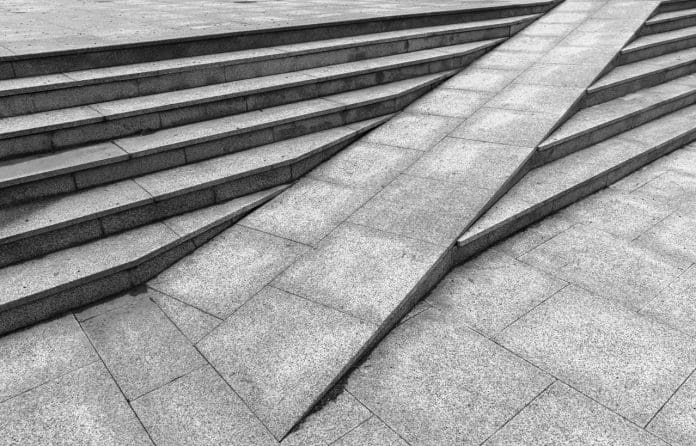 Gray granite stairs with a ramp, abstract outdoor urban architecture Anticipating the customer journey opens the door to good design