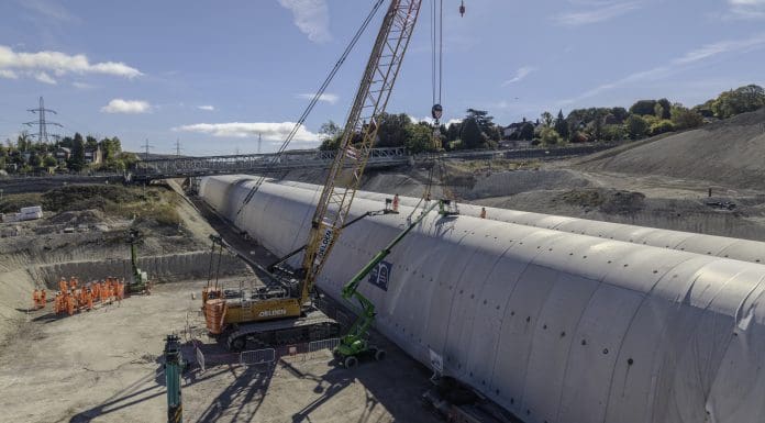 The last segment of the HS2 Wendover tunnel being lifted into place