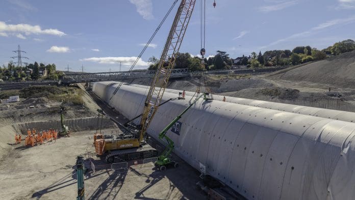 The last segment of the HS2 Wendover tunnel being lifted into place