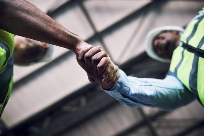 Shot of two builders shaking hands at a construction site The CIOB Hub Recognition Awards recognise the institute's progress