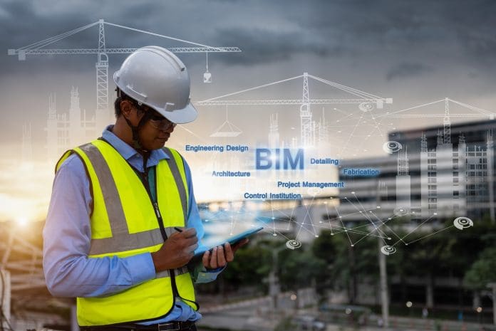 Engineering Consulting People on construction site holding tablet in his hand. Management in business workflow and Building inspector with BIM technology in Construction Project. BIM handover: Write an information brief the operator can use