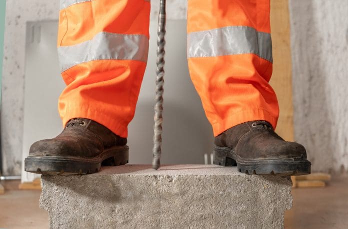 Construction worker drilling rocks Northern households lose over £3bn to rogue builders, says FMB