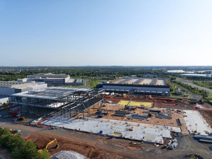 Data Center Construction Aerial view of a data center being constructed among existing centers.