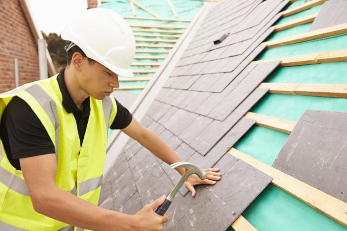Construction Worker On Building Site Laying Slate Tiles Roofing ranked among the lowest in terms of interest in construction apprenticeships
